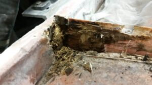 Ski boat floor and stringers before repair